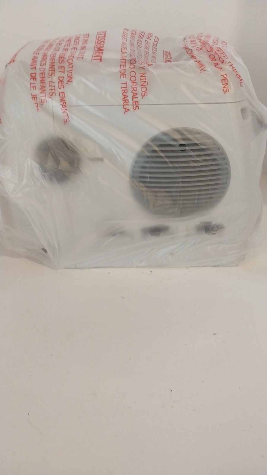 Figure 2f. Supersonic FC9600 - unboxed TV covered in plastic - side view of the power switch