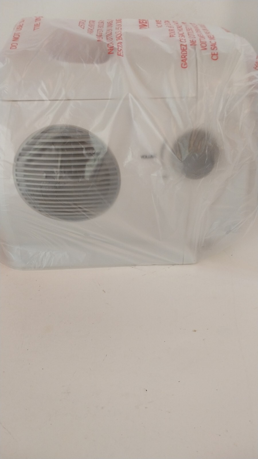 Figure 2h. Supersonic FC9600 - unboxed TV covered in plastic - side view of the volume control